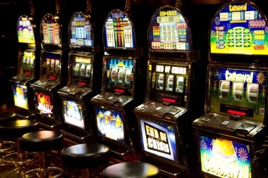 Poker player seated at a table with chip stack and decision buttons visible on screen